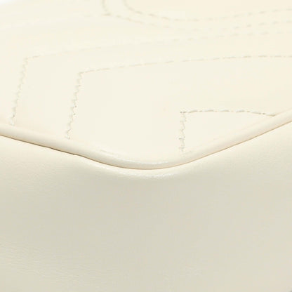 Exclusive Gucci White Calfskin Matelasse Super Mini GG Marmont Shoulder Bag — Lifestyle View