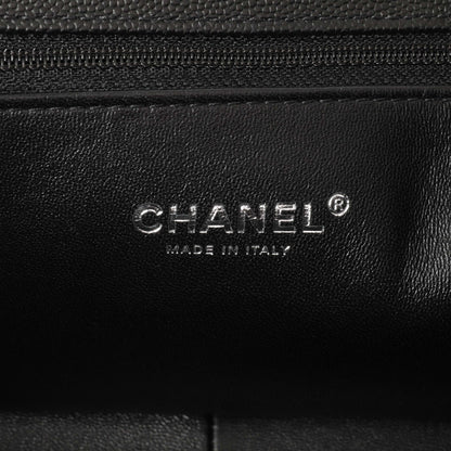 Exclusive Chanel Black Quilted Caviar New Medium Boy Bag — Lifestyle View