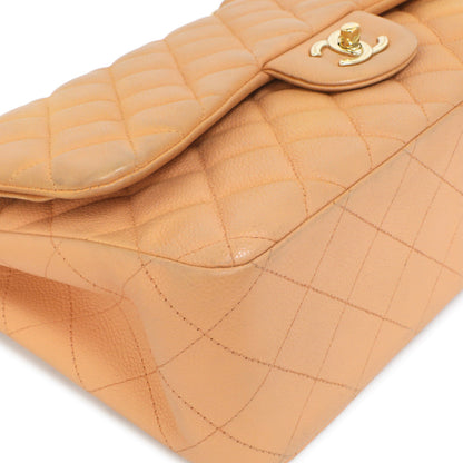 Exclusive Chanel Peach Quilted Caviar Jumbo Classic Double Flap — Lifestyle View