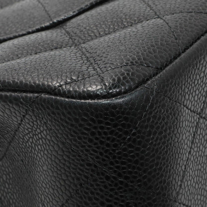 Exclusive Chanel Black Quilted Caviar Jumbo Double Flap — Lifestyle View
