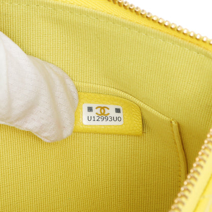 Exclusive Chanel Yellow Quilted Caviar Cosmetic Case — Lifestyle View