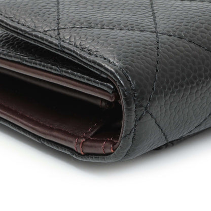 Exclusive Chanel Black Quilted Caviar Large Flap Wallet — Lifestyle View