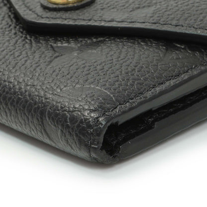 Exclusive Louis Vuitton Black Monogram Empreinte Leather Victorine Wallet — Detail View
