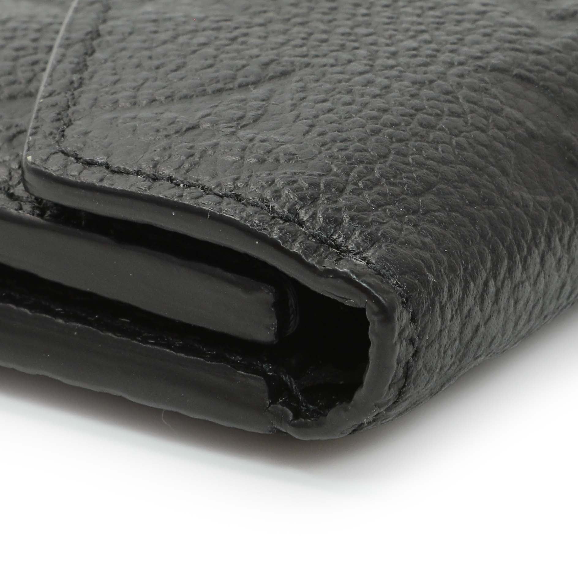 Exclusive Louis Vuitton Black Monogram Empreinte Leather Victorine Wallet — Lifestyle View