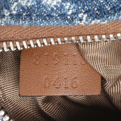 Exclusive Gucci Blue Monogram Denim Key Pouch — Lifestyle View