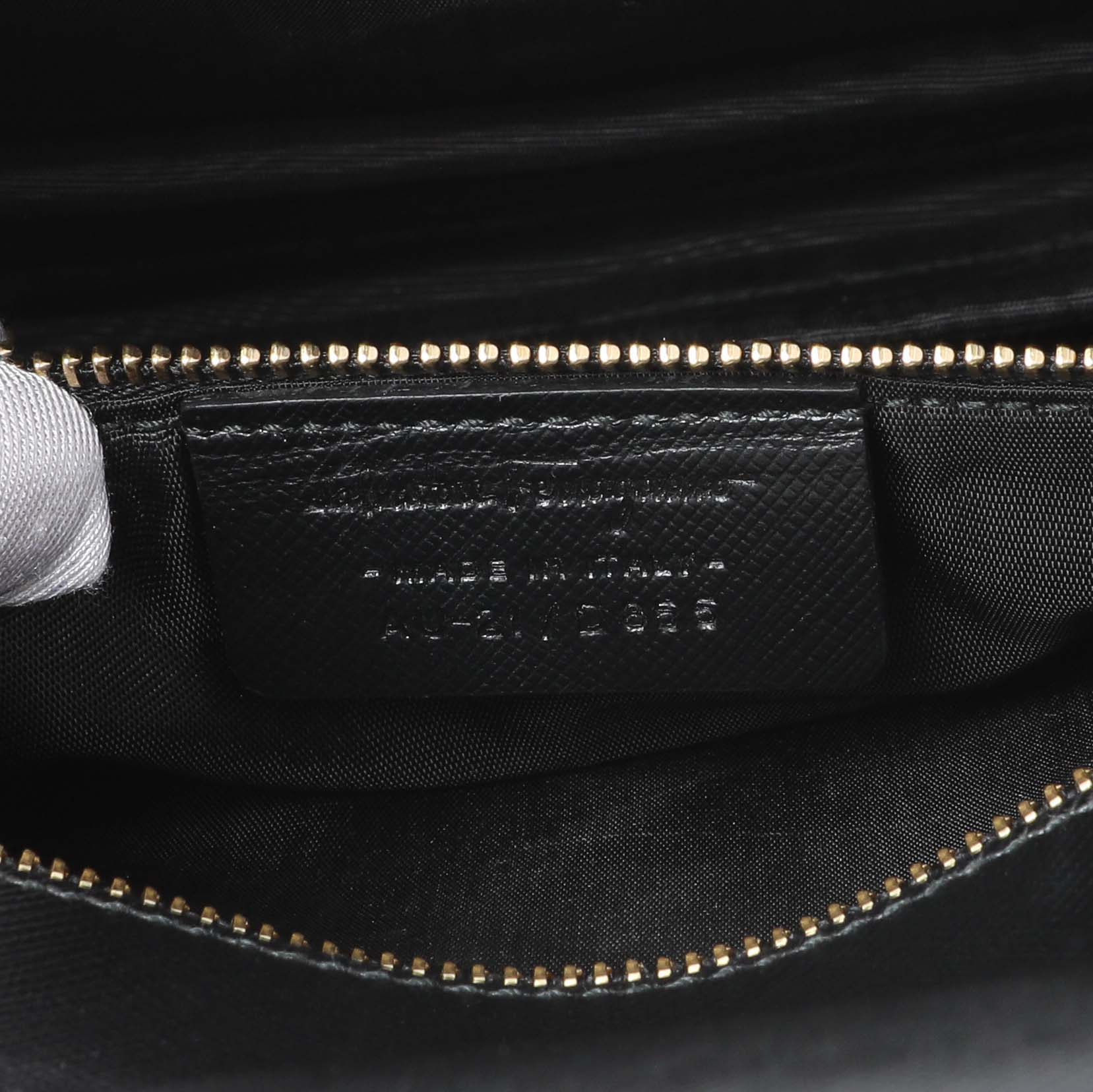 Exclusive Salvatore Ferragamo Black Calfskin Vara Bow Chain Flap Crossbody — Lifestyle View
