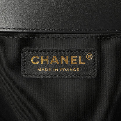 Exclusive Chanel Black Calfskin Chevron Quilted Medium Boy Bag — Lifestyle View