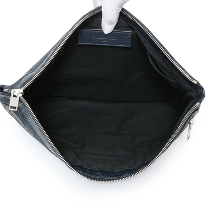 Exclusive Balenciaga Navy Agneau Arena Classic Silver Hardware Large Clip Clutch — Lifestyle View