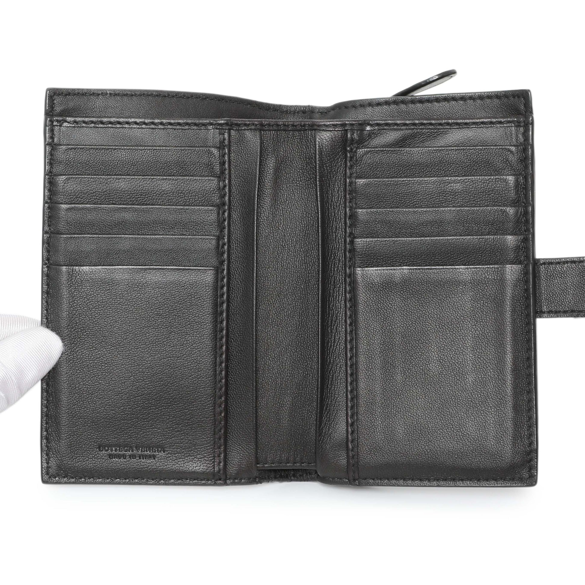 Exclusive Bottega Veneta Black Intrecciato Bi-Fold Compact Wallet — Lifestyle View