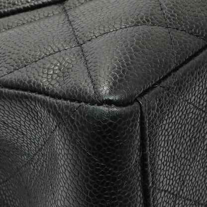 Exclusive Chanel Black Quilted Caviar Maxi Single Flap — Lifestyle View