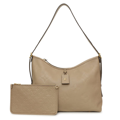 Exclusive Louis Vuitton Tourterelle Empreinte Monogram Giant Carryall MM — Front View