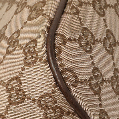 Exclusive Gucci Monogram Canvas Boat Pochette — Lifestyle View