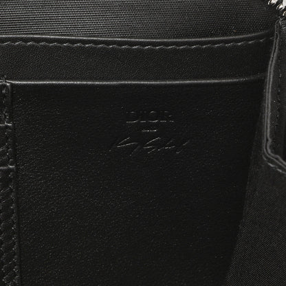 Exclusive Christian Dior X Kenny Scharf Oblique Embroidered Patches Double Zip Crossbody Pouch — Lifestyle View