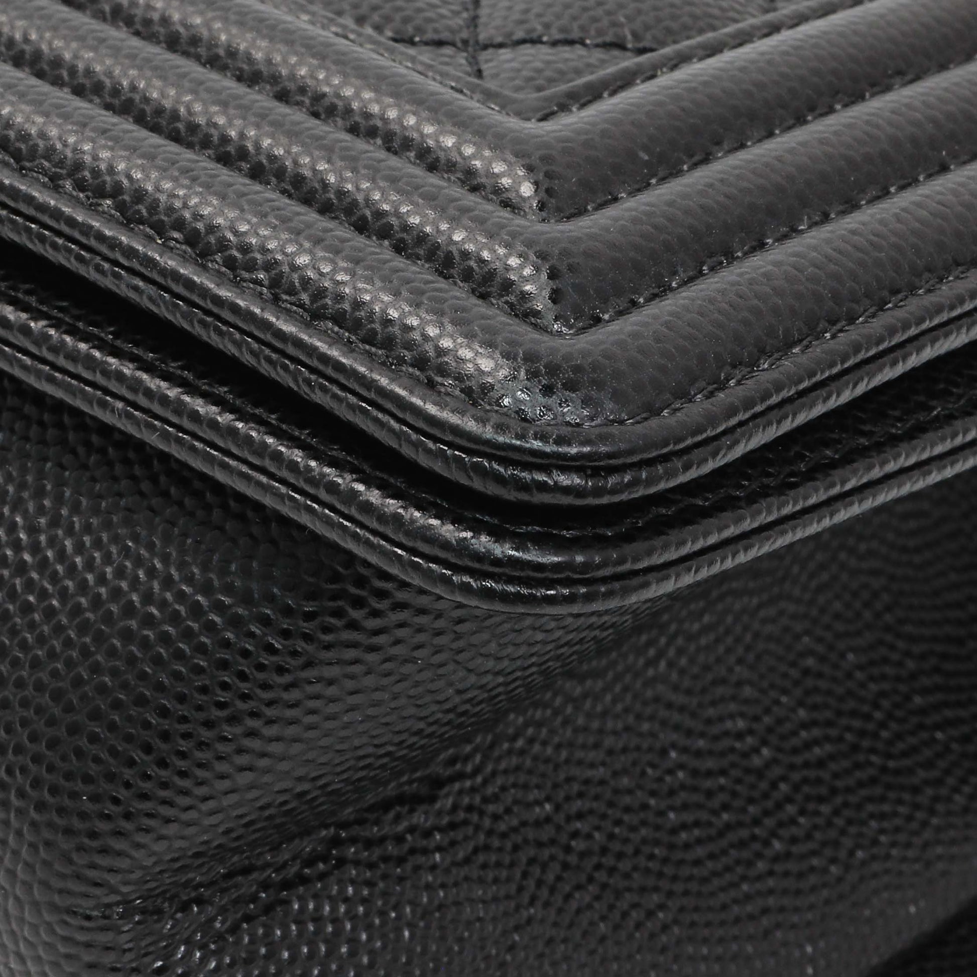 Exclusive Chanel Black Quilted Caviar Medium Boy Flap — Lifestyle View