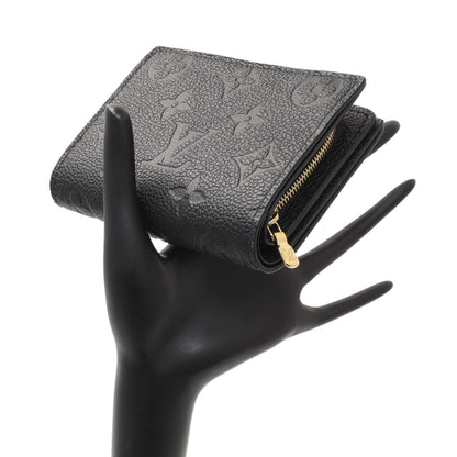 Exclusive Louis Vuitton Black Empreinte Clea Wallet — Lifestyle View