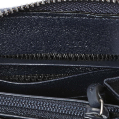 Exclusive Gucci GG Supreme Zipped Long Wallet — Lifestyle View