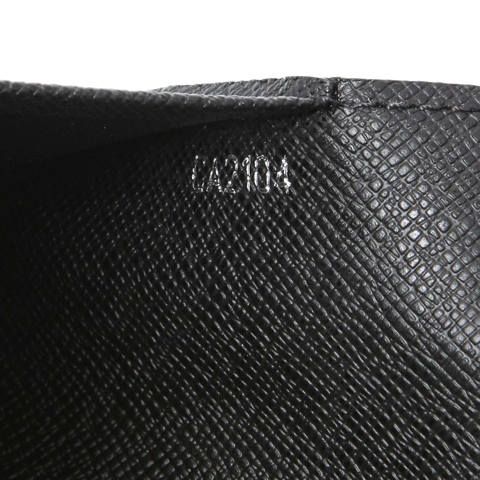 Exclusive Louis Vuitton Damier Graphite Passport Cover — Lifestyle View