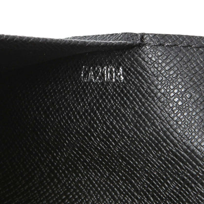 Exclusive Louis Vuitton Damier Graphite Passport Cover — Lifestyle View