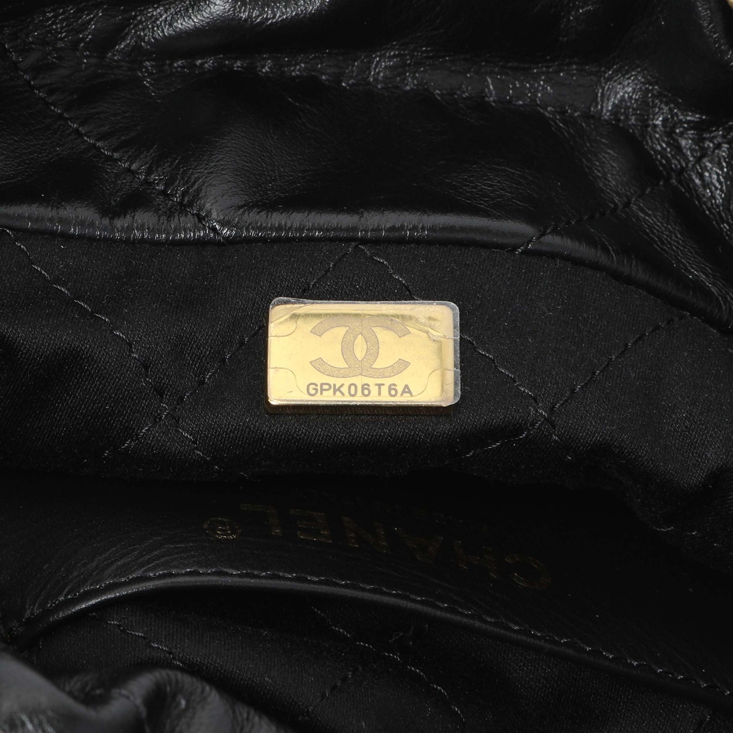 Exclusive Chanel Black Shiny Calfskin Quilted Mini Chanel 22 — Lifestyle View