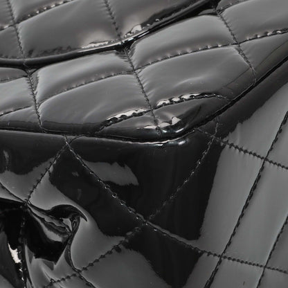 Exclusive Chanel Black Quilted Patent Jumbo Double Flap — Lifestyle View