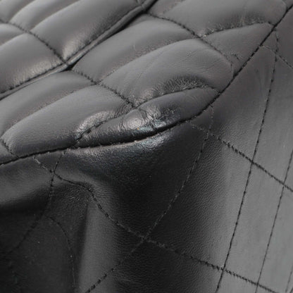Exclusive Chanel Black Lambskin Quilted Jumbo Double Flap — Lifestyle View