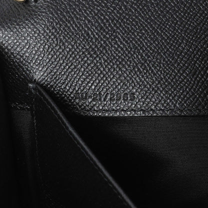 Exclusive Salvatore Ferragamo Black Grained Calfskin Gancio Clasp Chain Clutch — Lifestyle View