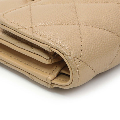 Exclusive Chanel Beige Quilted Caviar Tri-Fold Wallet — Lifestyle View