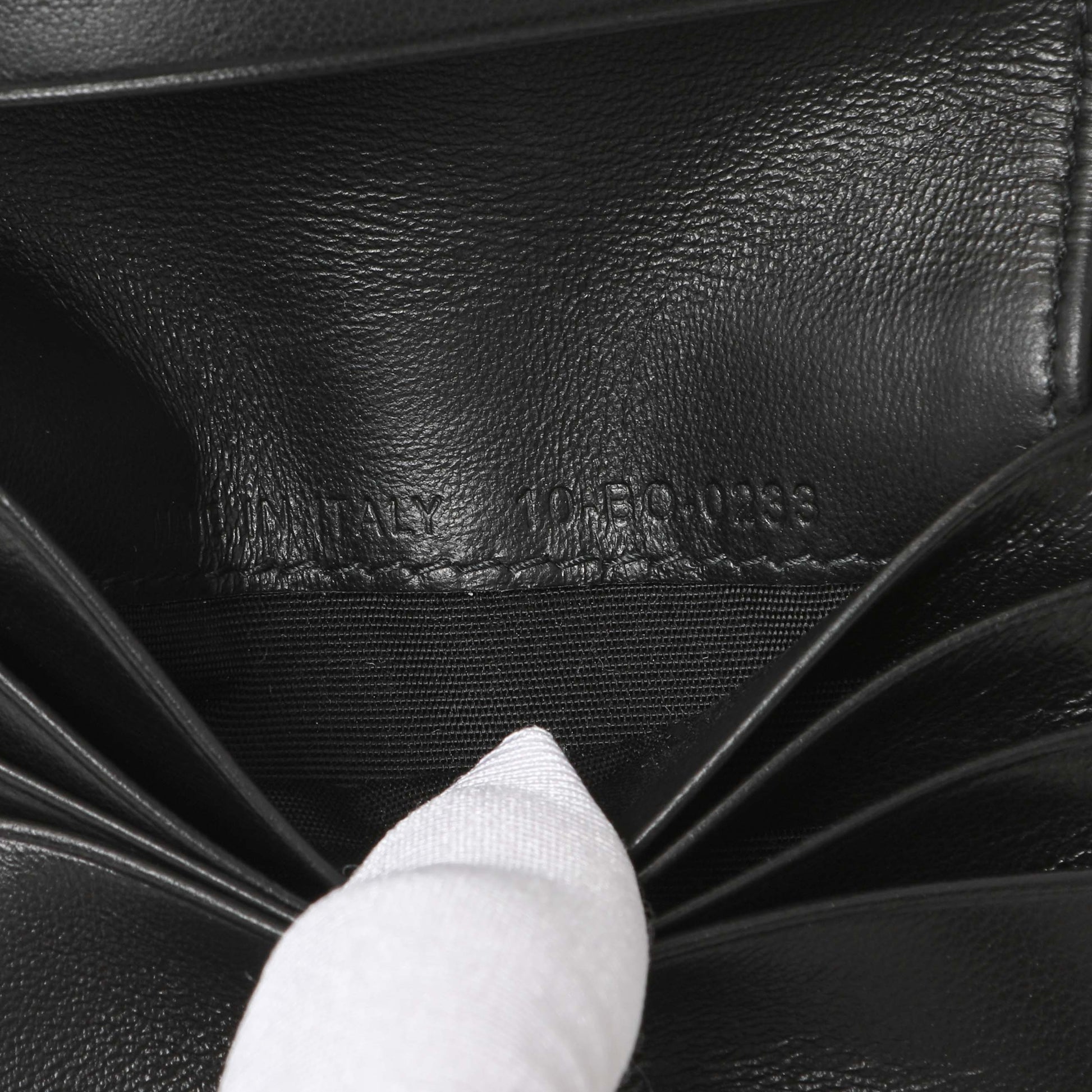 Exclusive Christian Dior Black Calfskin Perforated Oblique Vertical Card Holder — Lifestyle View