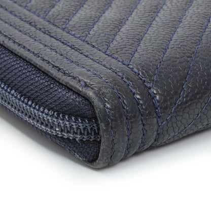 Exclusive Chanel Navy Chevron Quilted Caviar Boy Long Zip Around Wallet — Lifestyle View