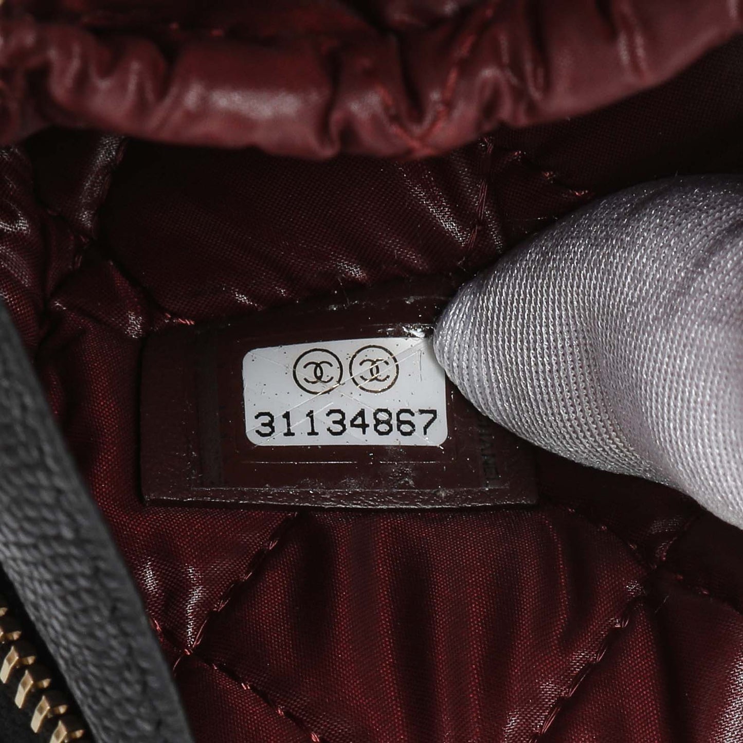 Exclusive Chanel Black Caviar Quilted Small Curvy Pouch Cosmetic Case — Lifestyle View
