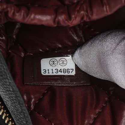 Exclusive Chanel Black Caviar Quilted Small Curvy Pouch Cosmetic Case — Lifestyle View