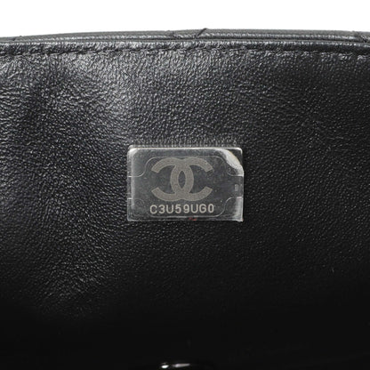 Exclusive Chanel Black Lambskin Mini Flap — Lifestyle View