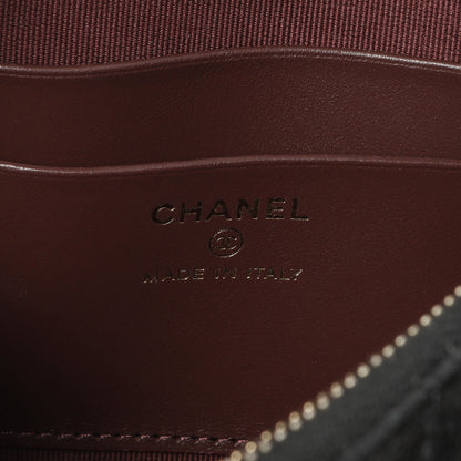 Exclusive Chanel Black Quilted Caviar Classic Clutch with Chain — Lifestyle View