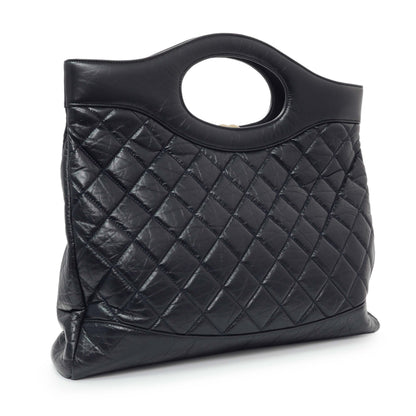 Exclusive Chanel Navy Quilted Aged Calfskin Large 31 Shopping Tote — Side View