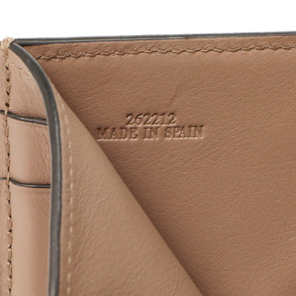 Exclusive Loewe Nude-Citronelle Soft Grained Calfskin Trifold Wallet — Lifestyle View