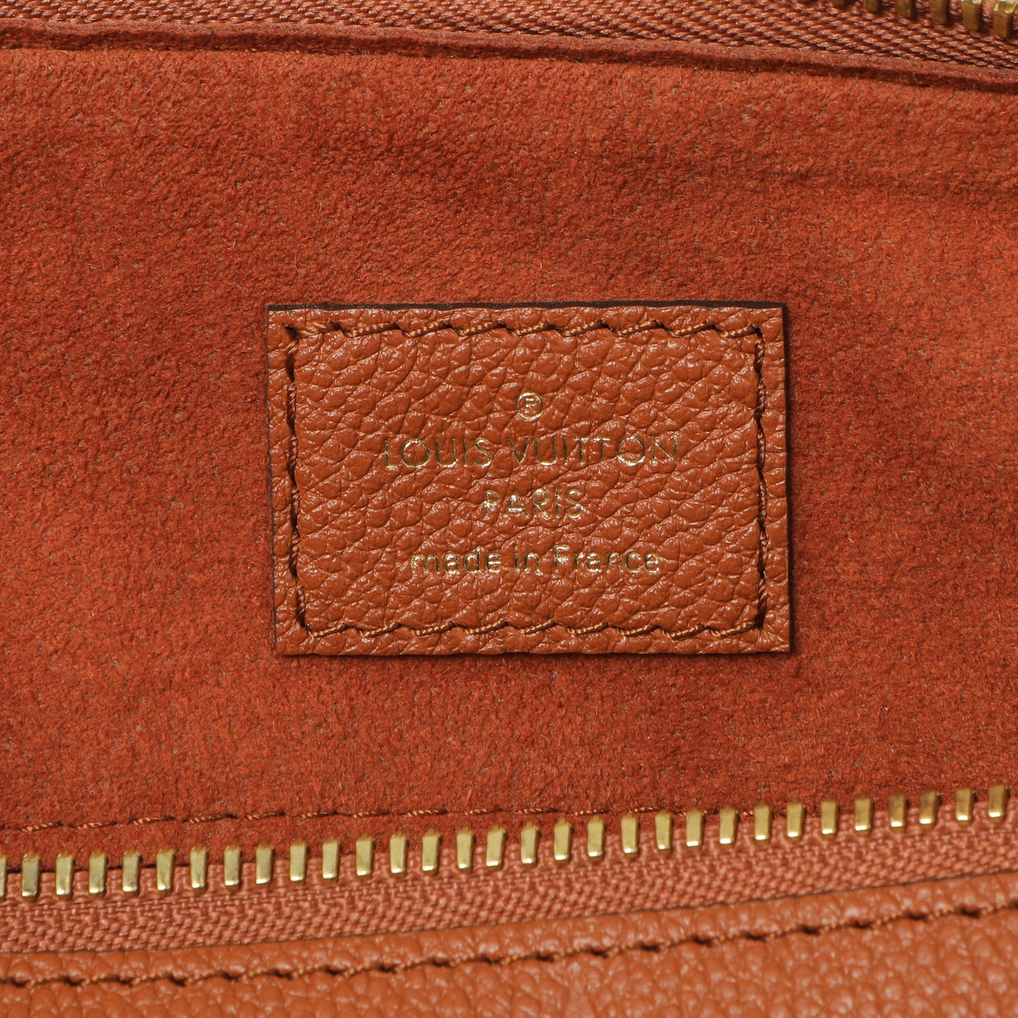 Exclusive Louis Vuitton Cognac Empreinte Monogram Giant Speedy Bandouliere 25 — Detail View