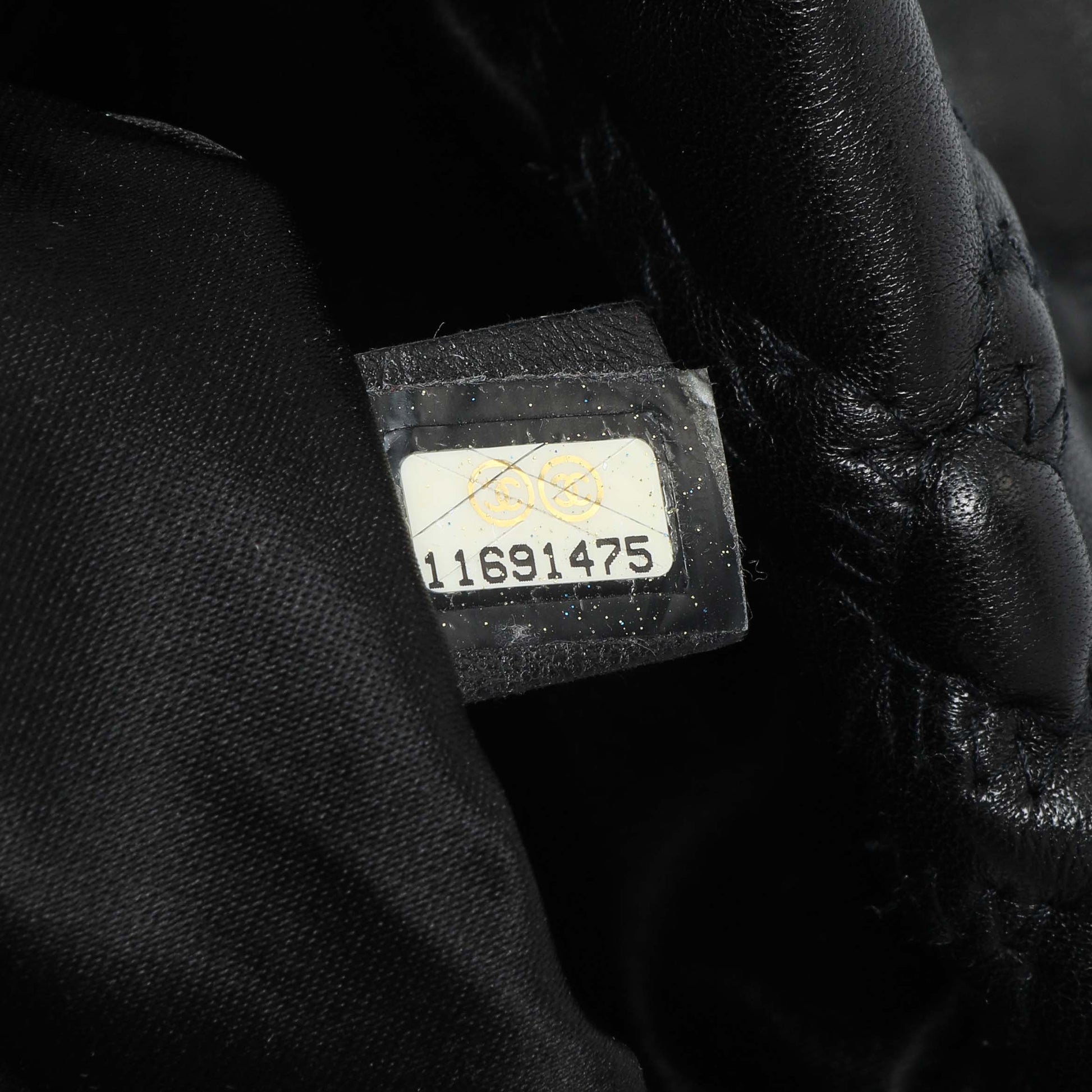 Exclusive Chanel Black Quilted Lambskin Hidden Chain Flap Bag — Lifestyle View
