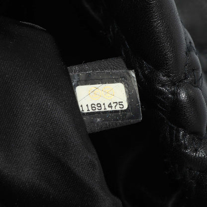 Exclusive Chanel Black Quilted Lambskin Hidden Chain Flap Bag — Lifestyle View