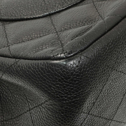 Exclusive Chanel Black Quilted Caviar Jumbo Double Flap — Lifestyle View