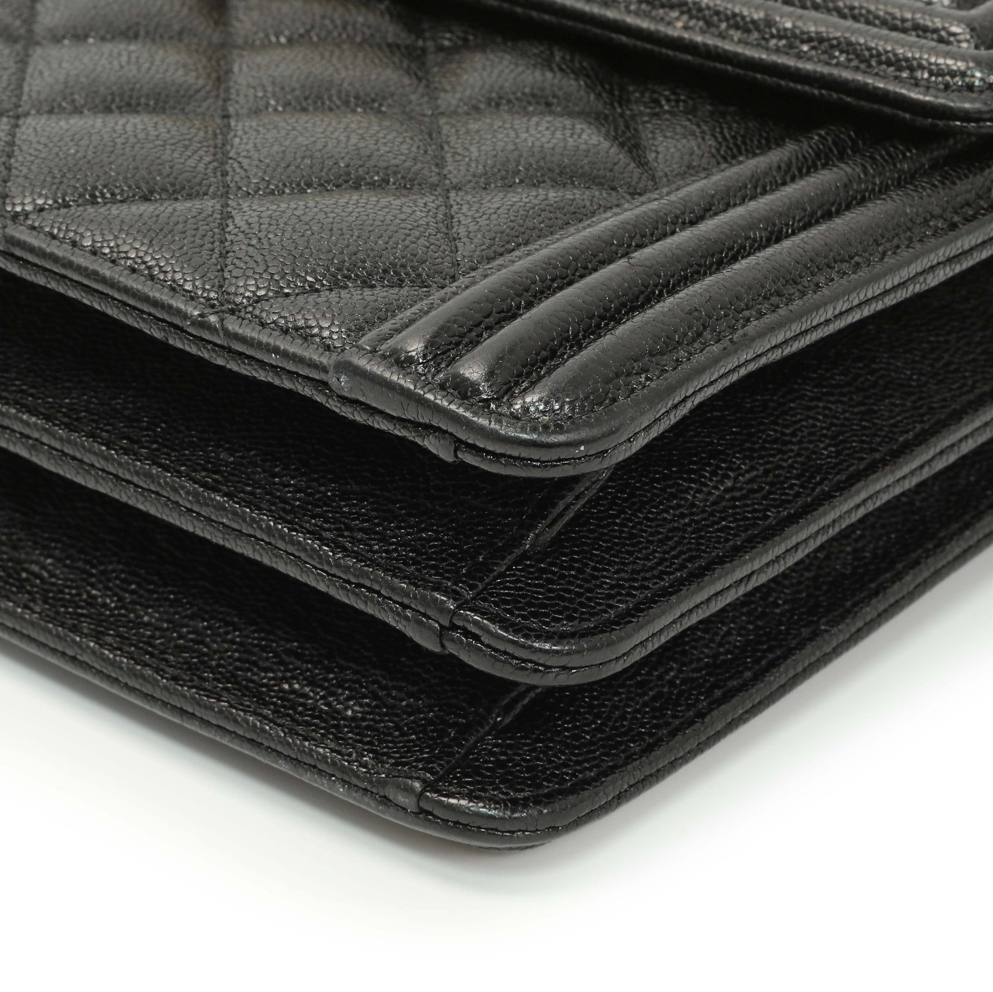 Exclusive Chanel Black Quilted Caviar North South Boy Flap — Lifestyle View