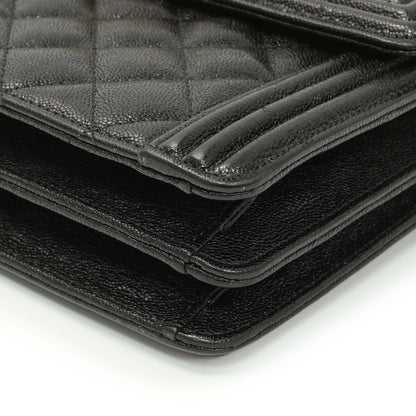 Exclusive Chanel Black Quilted Caviar North South Boy Flap — Lifestyle View
