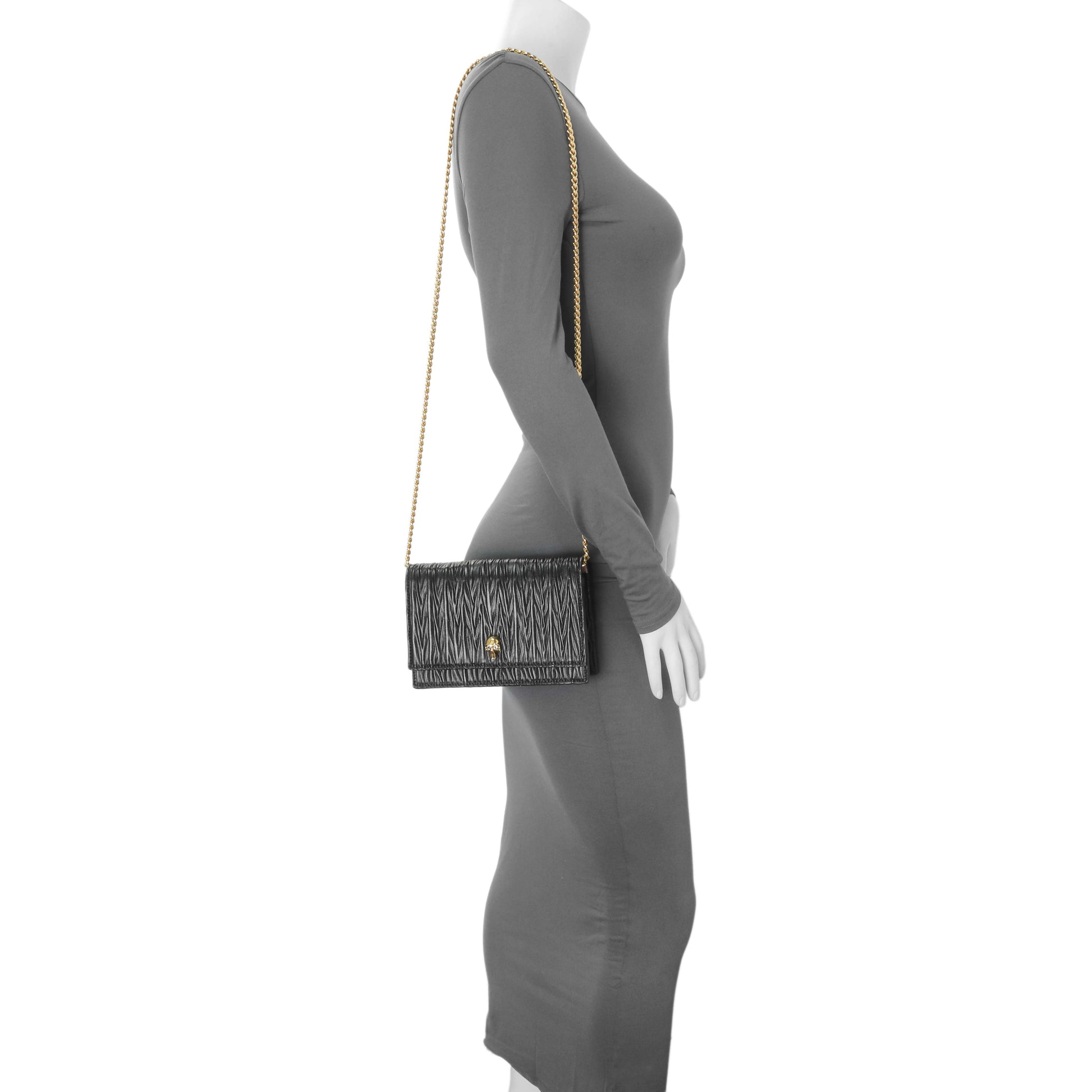 Exclusive Alexander McQueen Black Pleated Skull Mini Crossbody Bag — Lifestyle View