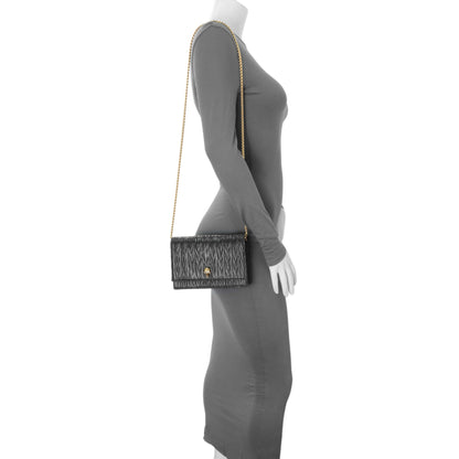 Exclusive Alexander McQueen Black Pleated Skull Mini Crossbody Bag — Lifestyle View