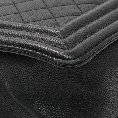 Exclusive Chanel Black Quilted Caviar New Medium Boy Bag — Lifestyle View