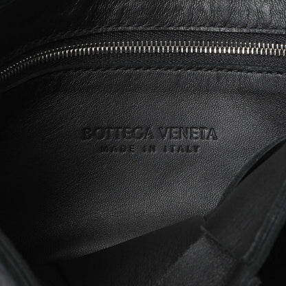 Exclusive Bottega Venetta Black Lambskin Maxi Intrecciato Cassette Crossbody Bag — Lifestyle View