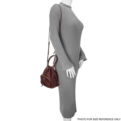 Exclusive Prada Burgundy Re-Nylon Saffiano Duet Bucket Crossbody Bag — Lifestyle View