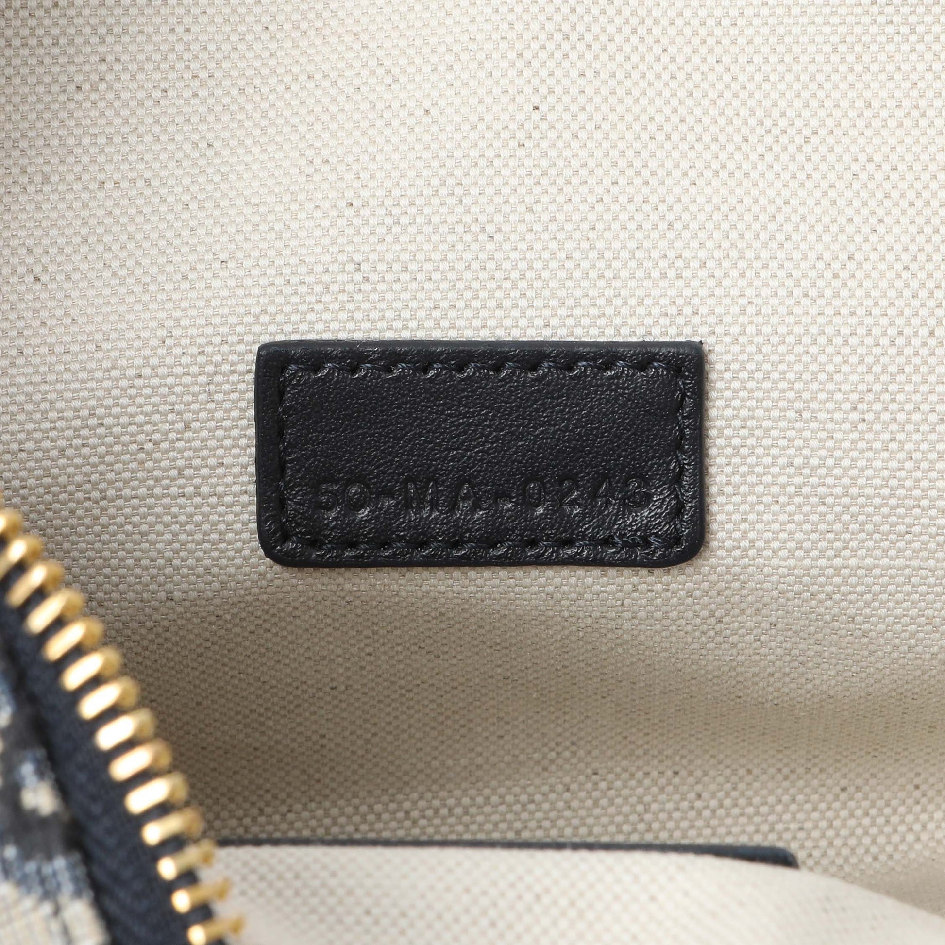 Exclusive Christian Dior Blue Oblique Jacquard Medium DiorTravel Nomad Pouch — Lifestyle View