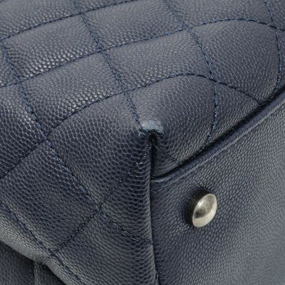 Exclusive Chanel Navy Quilted Caviar Lizard Medium Coco Handle — Lifestyle View