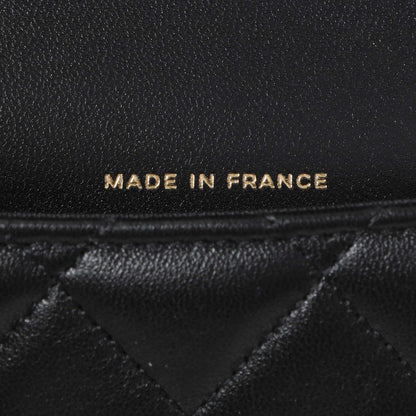 Exclusive Chanel Black Lambskin Top Handle Flap Coin Purse With Chain — Lifestyle View