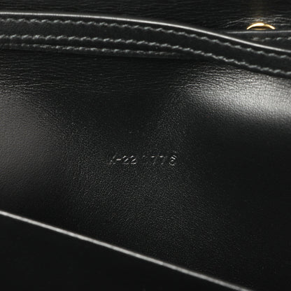 Exclusive Salvatore Ferragamo Black Calfskin Vara Bow Wallet — Lifestyle View